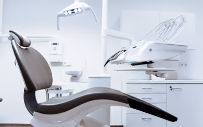 A calm, modern dental treatment room with natural light